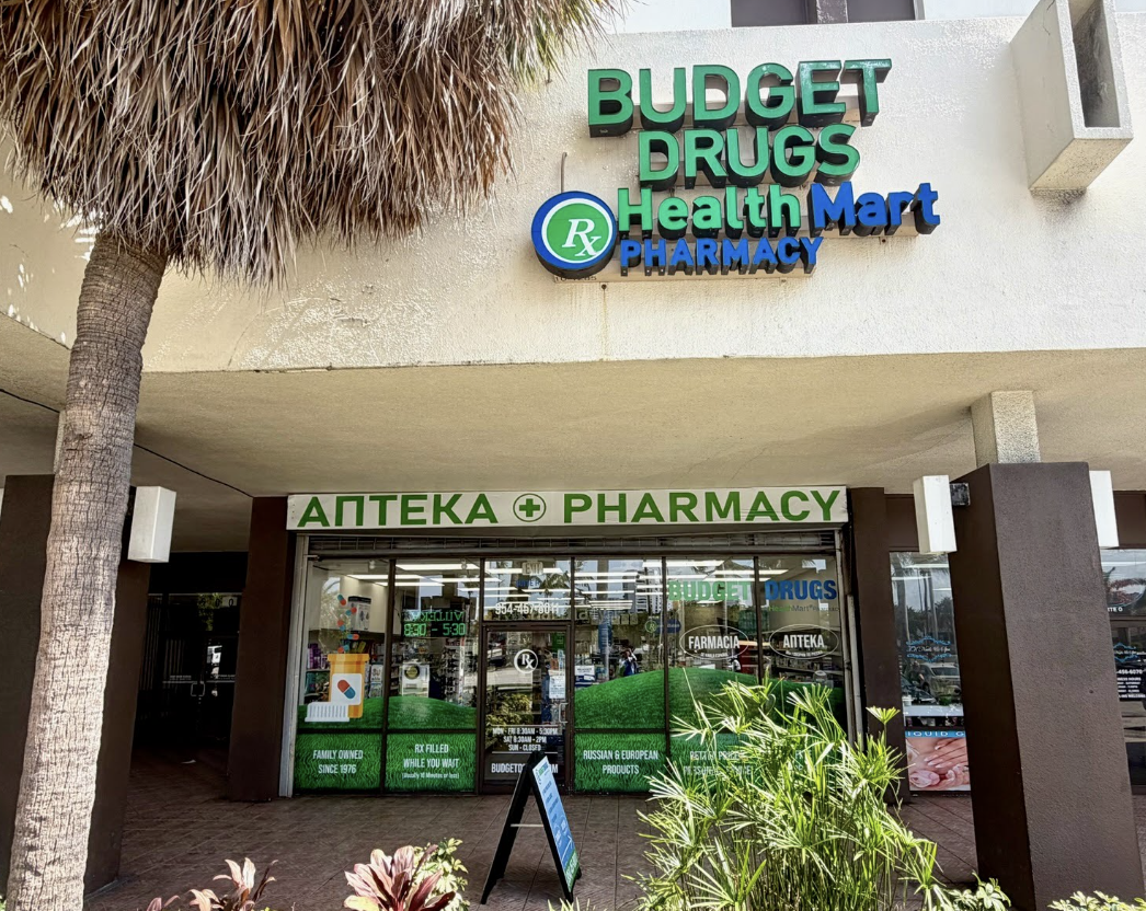 Budget Drugs Pharmacy storefront at 2500 E Hallandale Beach Blvd, an independent HealthMart pharmacy and drug store in Hallandale Beach, FL